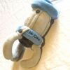 Arrière peluche normale pince grise visage souriant