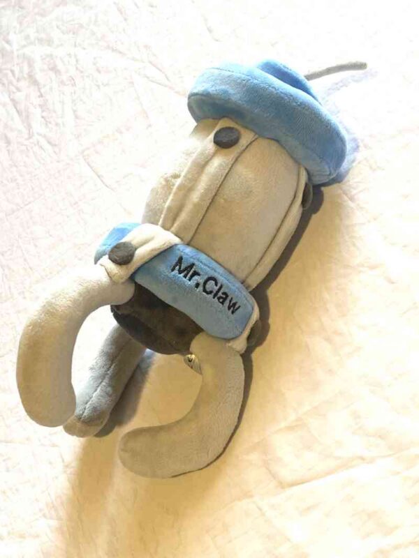 Arrière peluche normale pince grise visage souriant