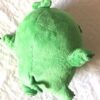 Arrière peluche normale boule verte cochon petites pattes mains oreilles