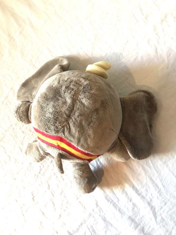 Arrière peluche normale élephanteau gris grosse boule aplatie grandes oreilles chapeau jaune cône boutique enfance-douceur Arrière peluche normale élephanteau gris grosse boule aplatie grandes oreilles chapeau cône