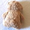 Arrière peluche normale petit ourson brun traces pattes marrons sous pieds