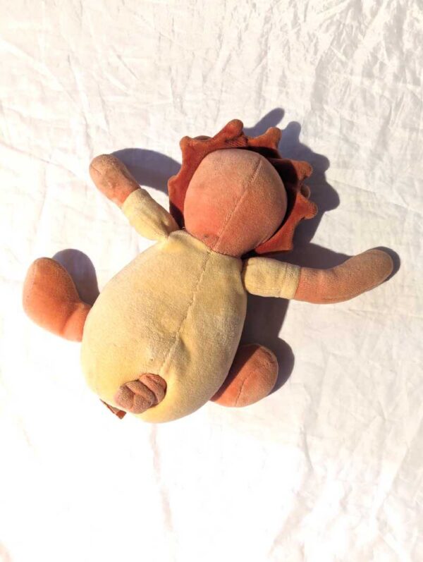 Arrière peluche normale petit ourson marron queue musicale crinière lion