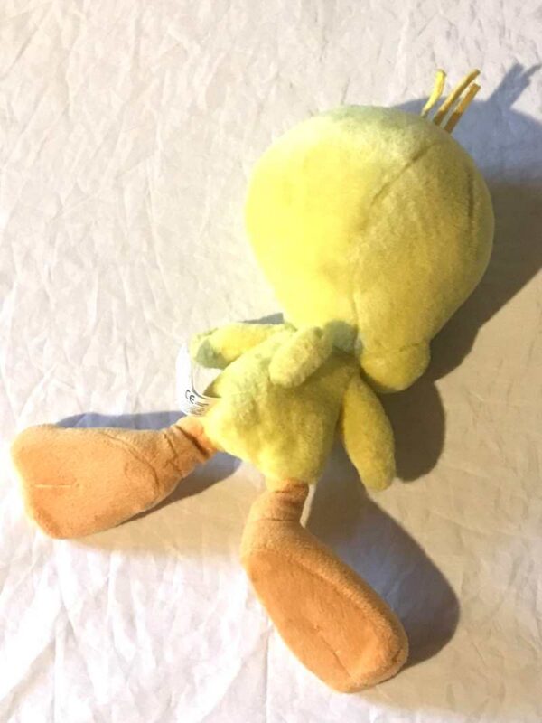 Arrière peluche normale petit titi jaune grand yeux pattes bec oranges