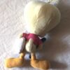 Arrière peluche normale petit titi jaune oreiller blanc brosse à dents bleue