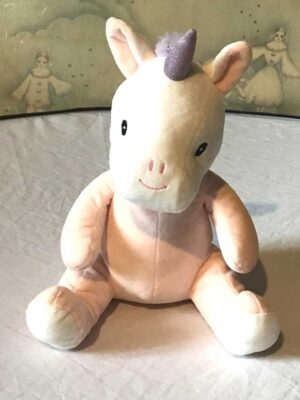 Peluche normale licorne assise vêtement rose corne violette pailletée
