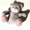 Peluche normale petit ourson gris petites fleurs pattes intérieur oreilles