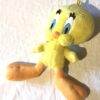 Peluche normale petit titi jaune grand yeux pattes bec oranges